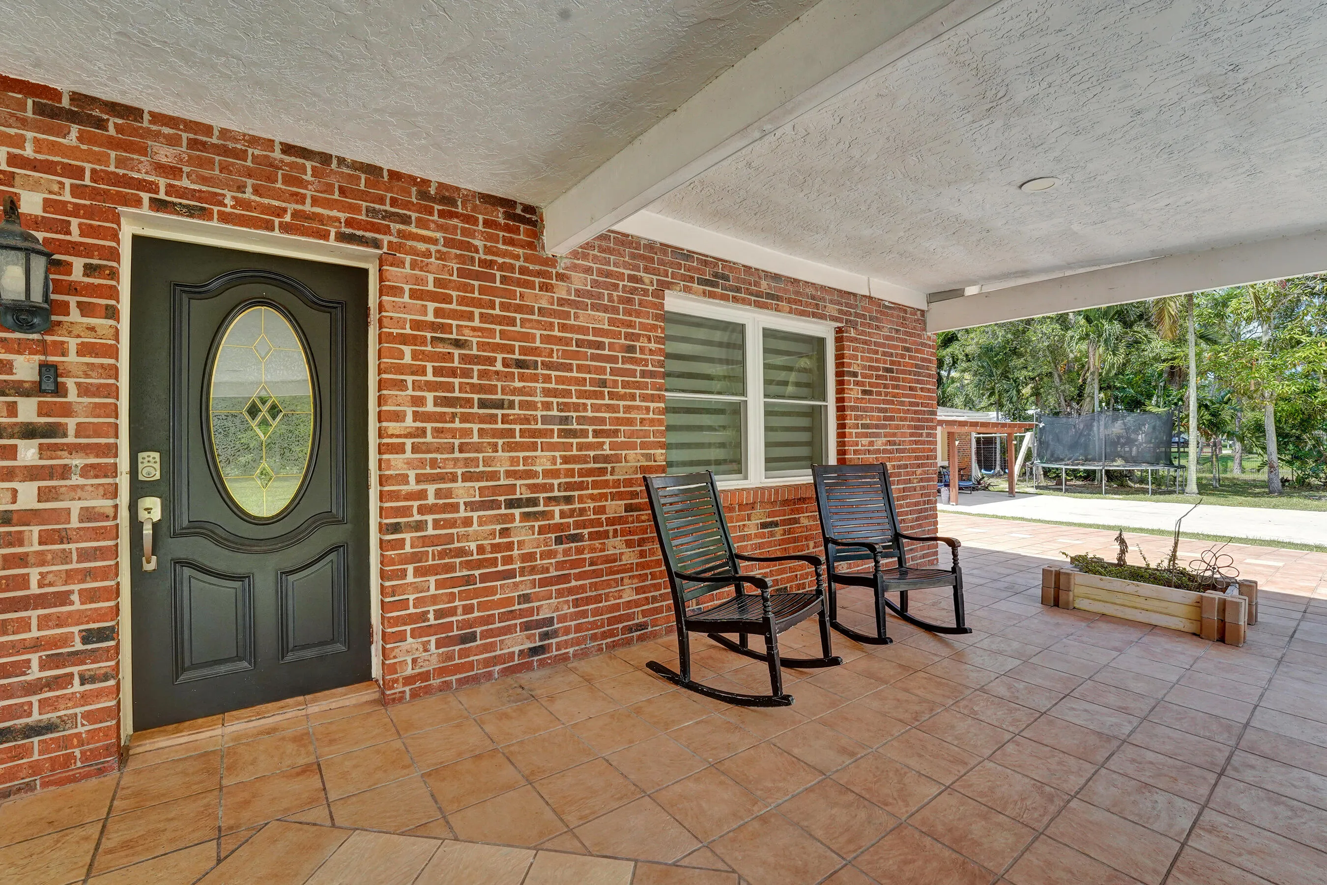 Front covered porch with beautiful brick entrance