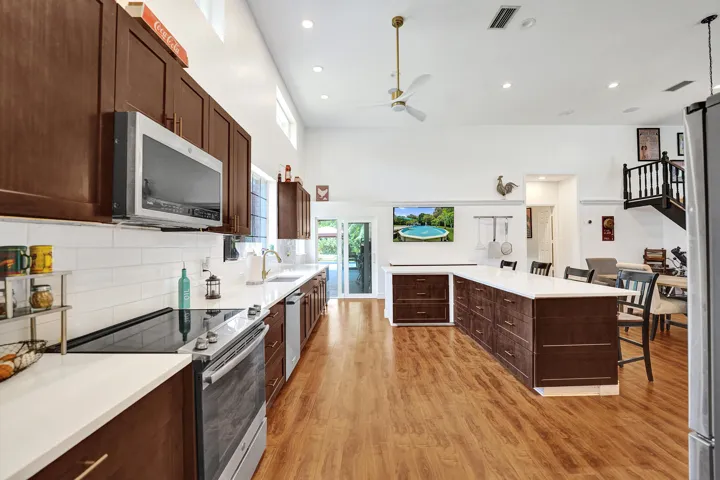 Kitchen with quartz counters, huge center island and coffee/wine bar station.
