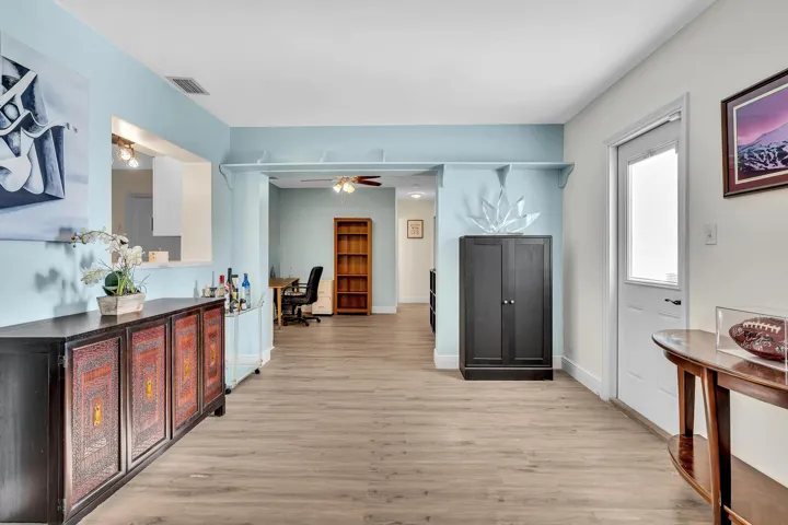 Light wood-finish flooring throughout the main living areas