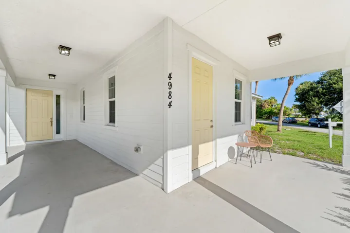 Front porch, separate entrance to one bedroom.