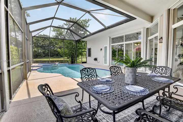Covered patio, lots of space for entertaining overlooking the lake