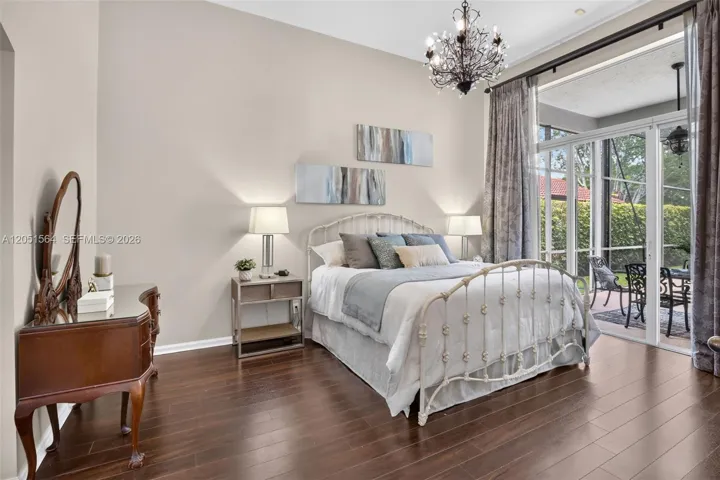 Master bedroom overlooking the pool and lake.
