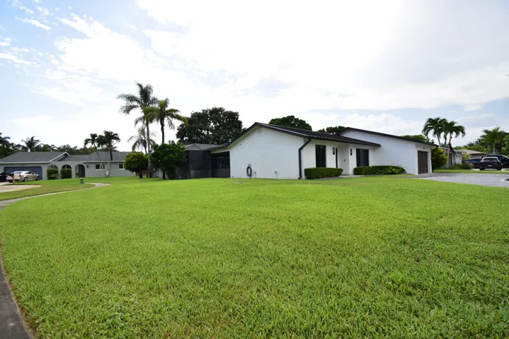 Spacious front yard with expansive green lawn