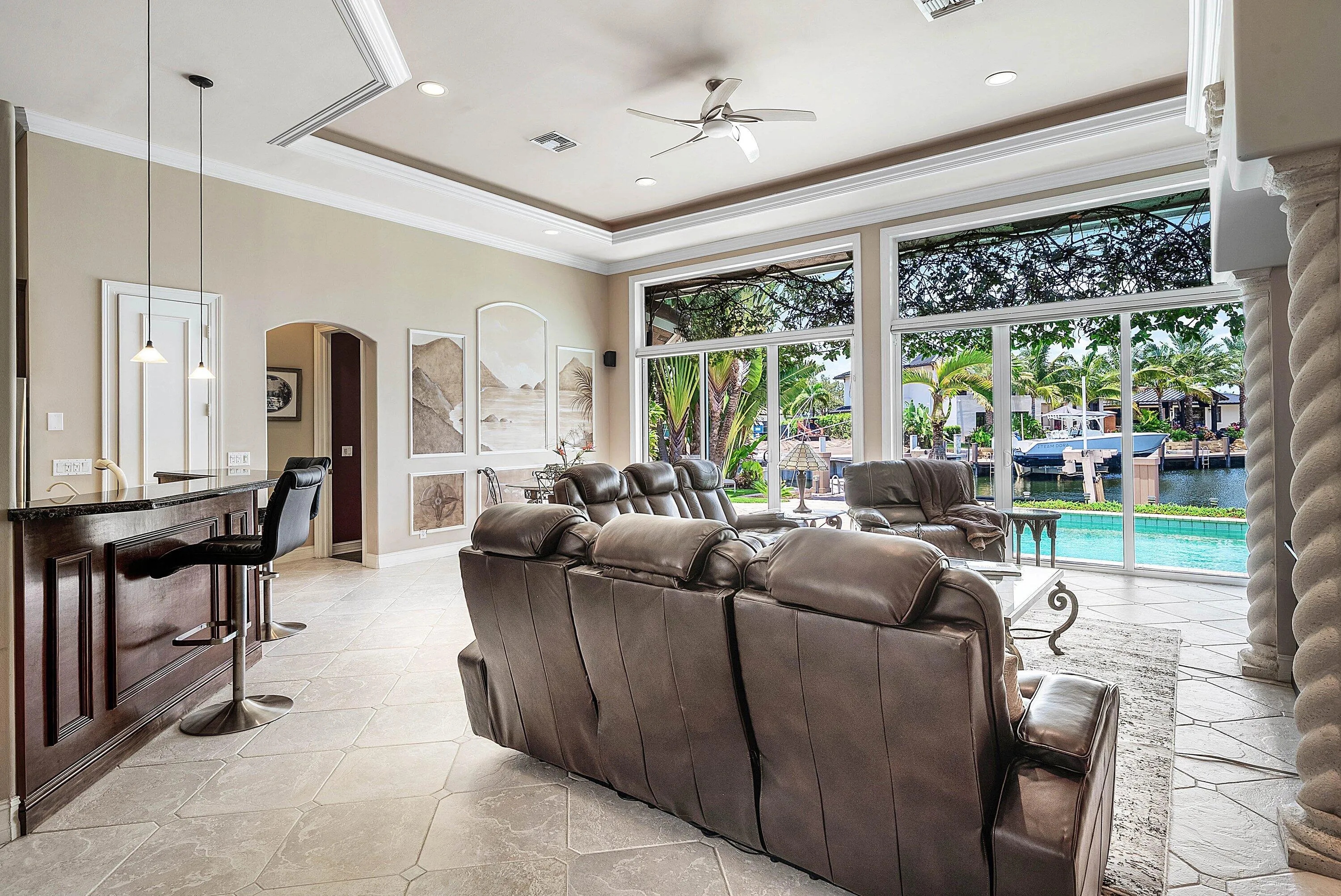 Open-concept living area with extensive waterfront views