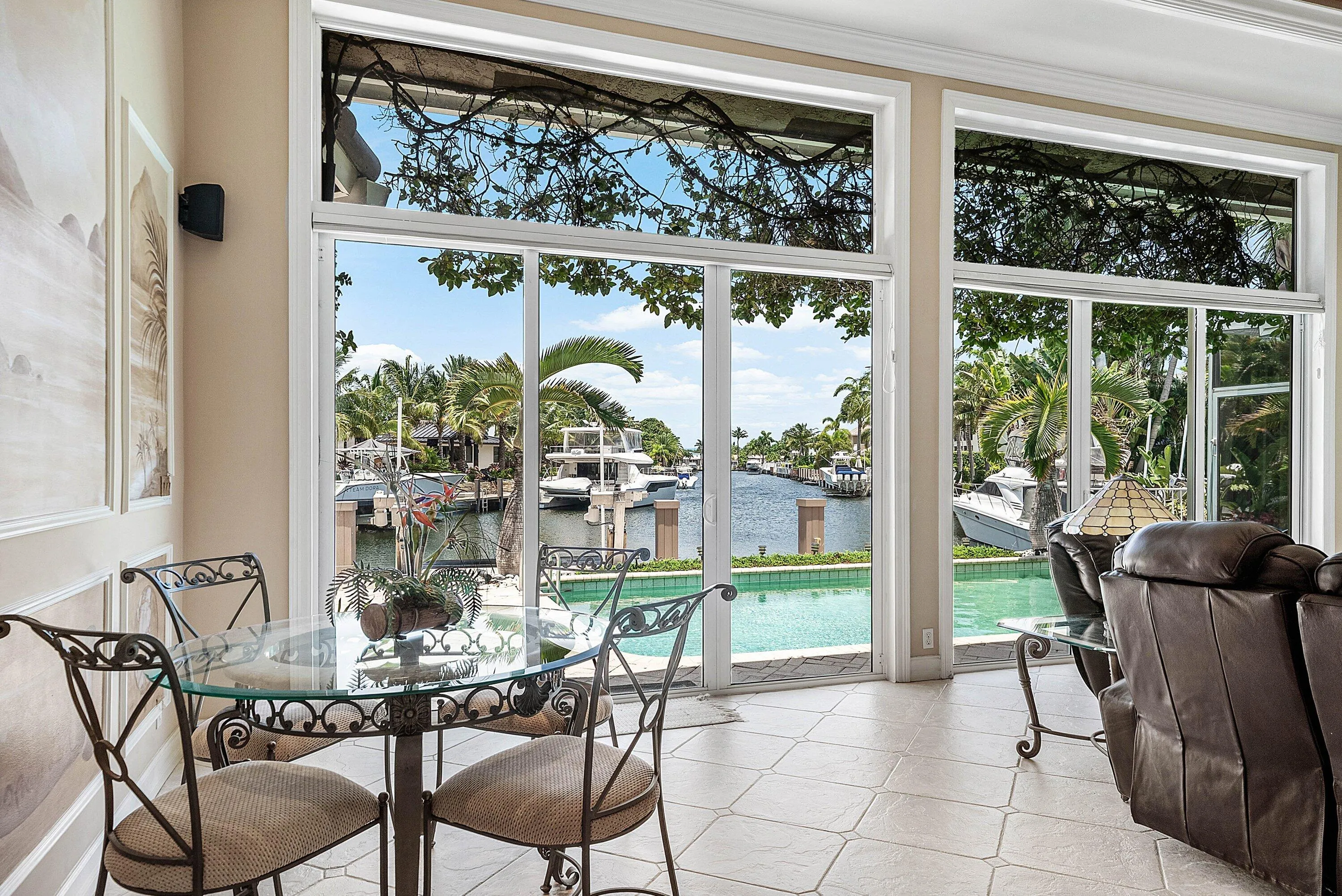 Spacious interior with large windows providing extensive water frontage