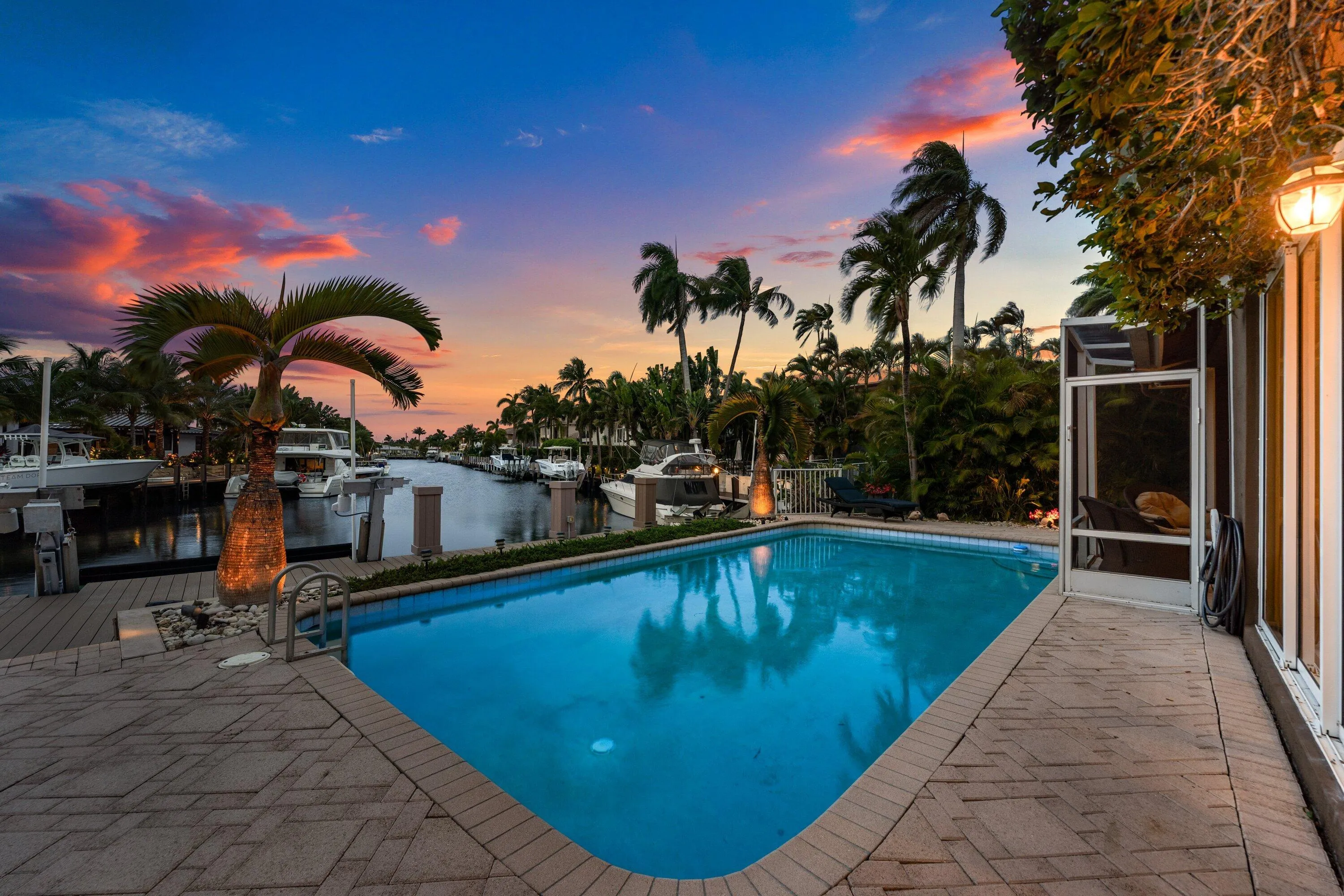 Swimming pool with paver decking and integrated lighting