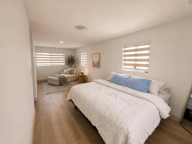 Master Suite Spacious interior room featuring light wood-finish flooring