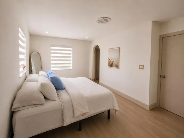 Light wood-finish flooring complements the neutral wall tones