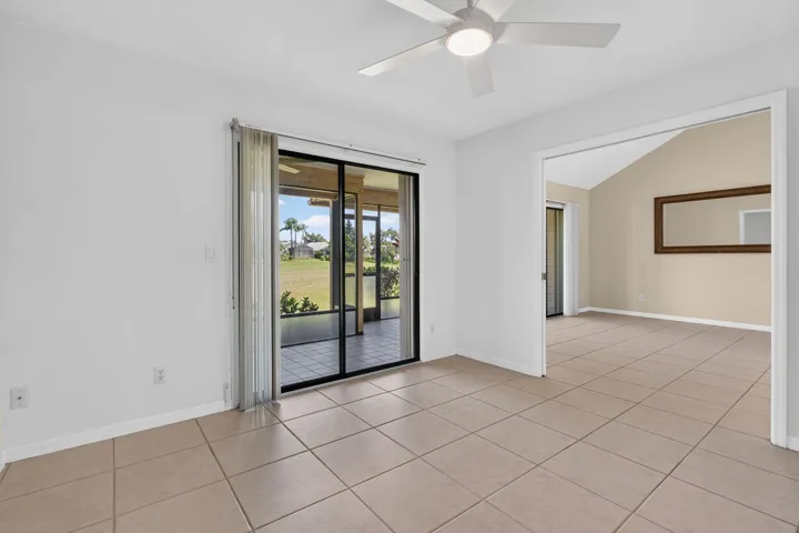 Bedroom 3 is a convertable room WITH a closet and golf views. New paint and fan.