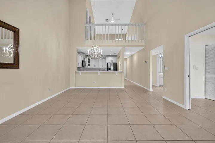 Great room showing vaulted ceilings and loft space. New fan.