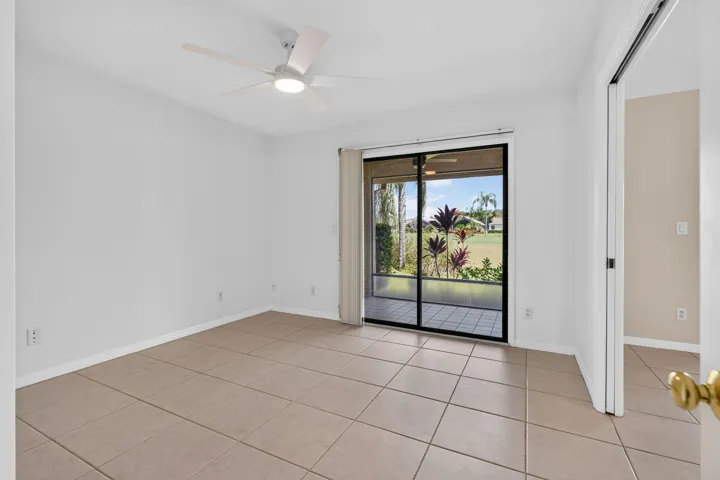 Bedroom 3 is a convertable room WITH a closet and golf views. New paint and fan.