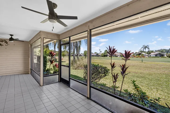 Screened patio looking at the golf course. 2 new fans.