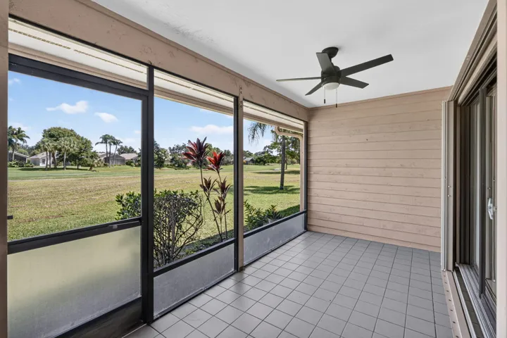 Screened patio looking at the golf course. New fan.