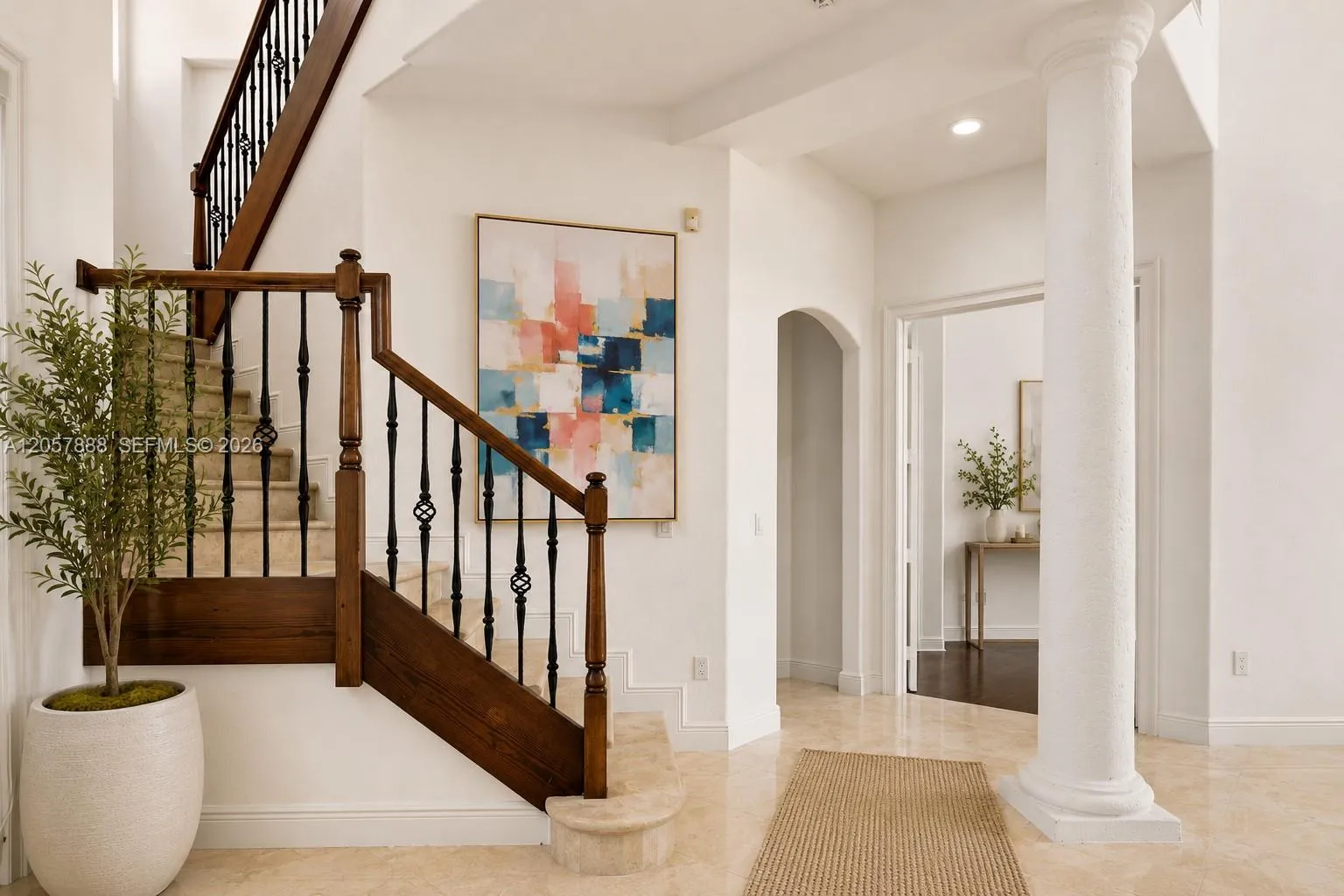 GRAND FOYER WITH A STAIRWAY TO NEW MEMORIES!