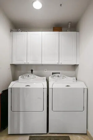 Separate laundry RM w/ full side by side Washer & Dryer