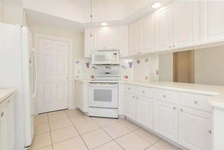 Bright kitchen with tile flooring