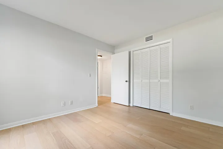 Bedroom with a built-in closet and clean, neutral​​‌​​​​‌​​‌‌​‌‌​​​‌‌​‌​‌​‌​​​‌​​ finishes