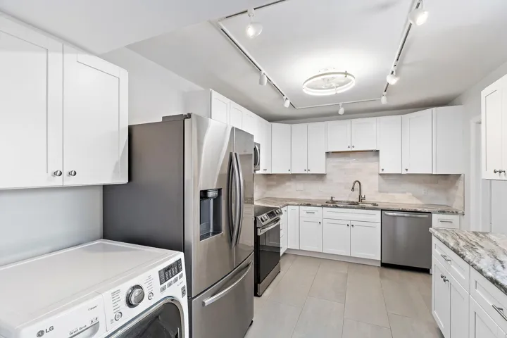 Updated kitchen with stainless appliances and full-size in-unit laundry