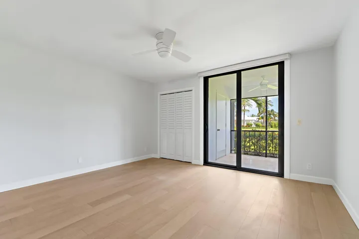 Bedroom opens to the screened patio and golf views