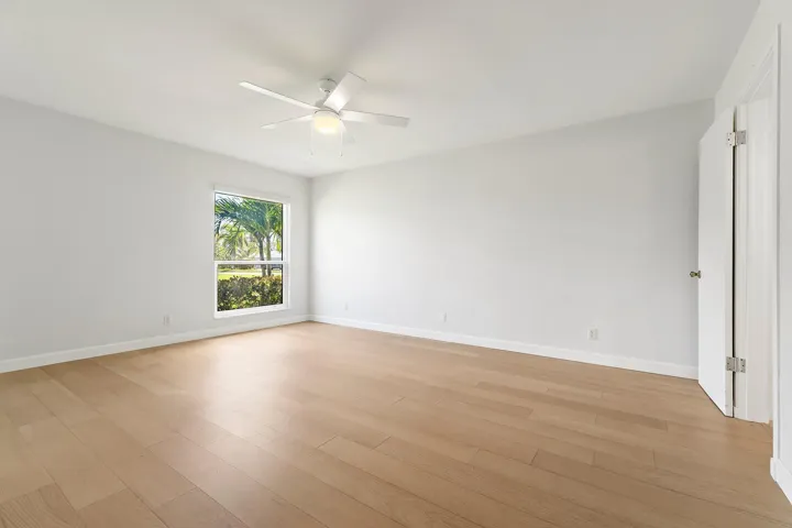 Spacious bedroom with green views and new flooring