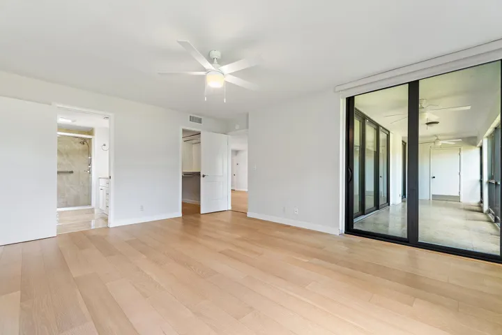 Spacious great room opens to the screened patio and golf course views