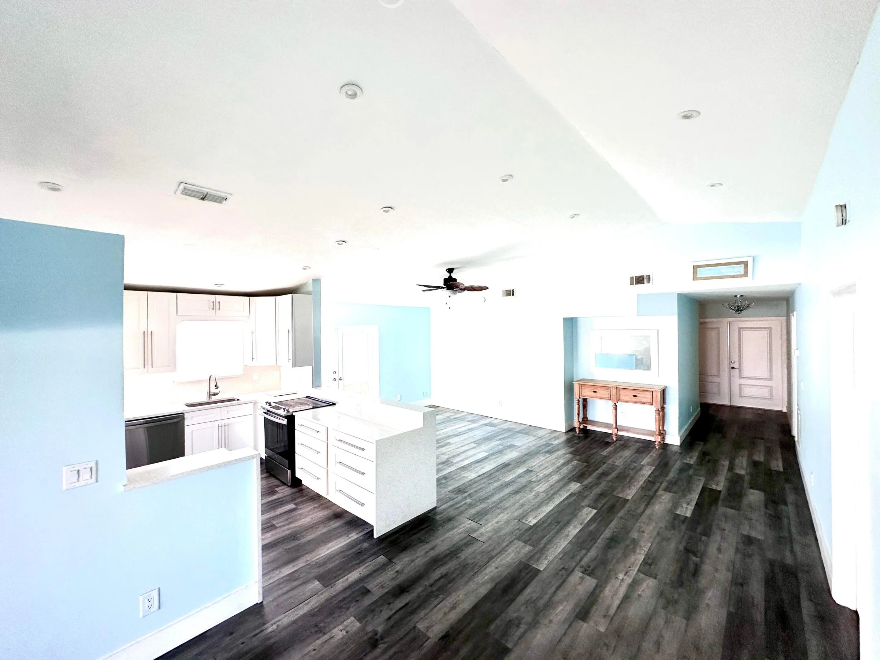 Open layout kitchen, dining area, and living room for effortless living and entertaining.