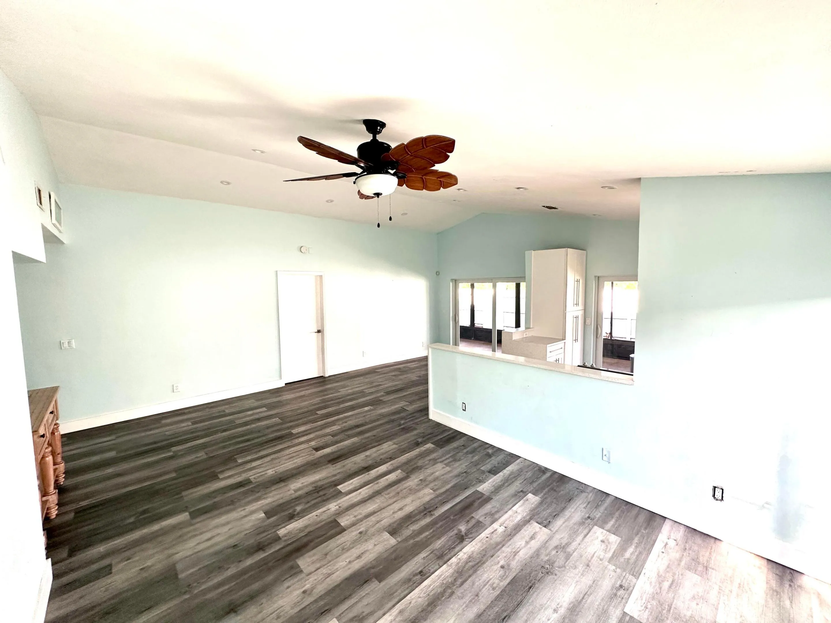 Abundant natural light fills the entire home, highlighting the open kitchen, dining room, and living area.