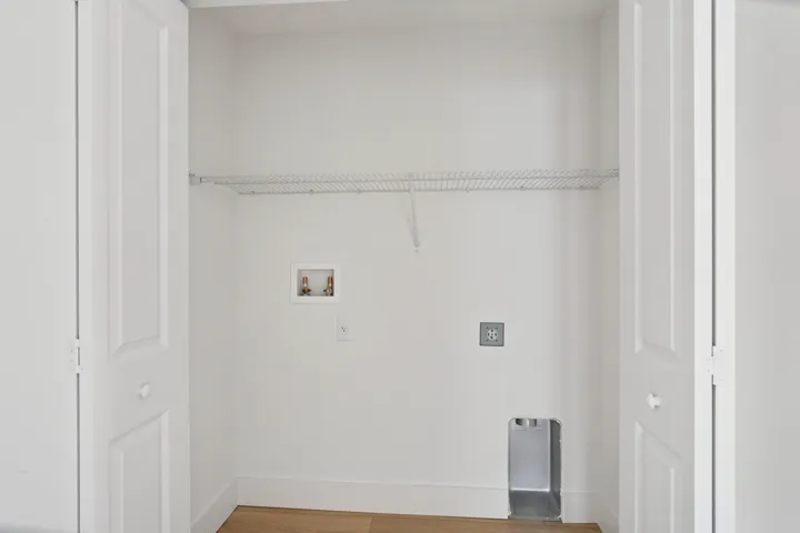 Laundry and utility closet off hallway