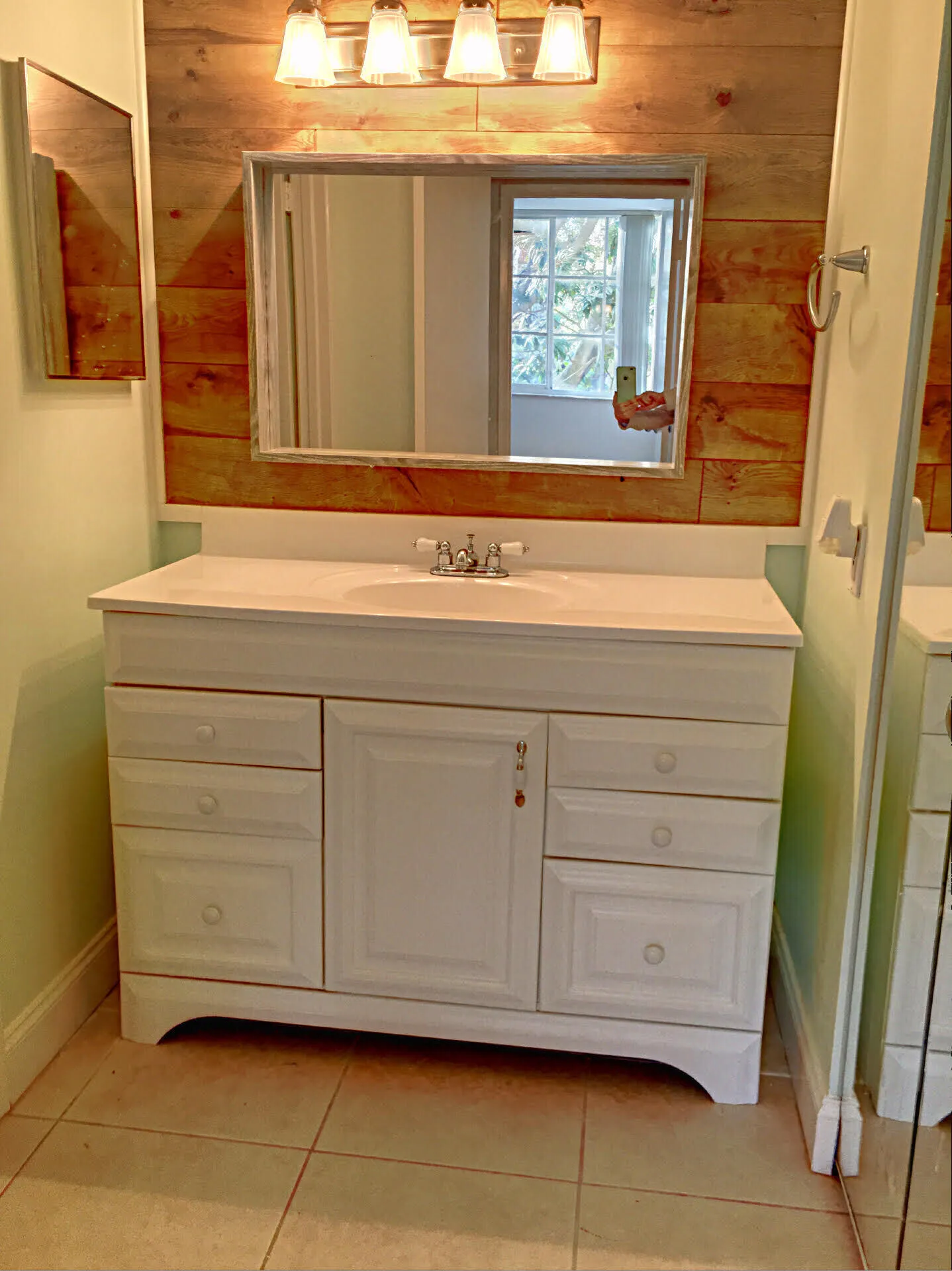 White vanity with an integrated sink and chrome faucet