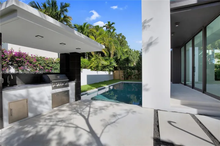 BBQ, Pool and covered porch back stucture.