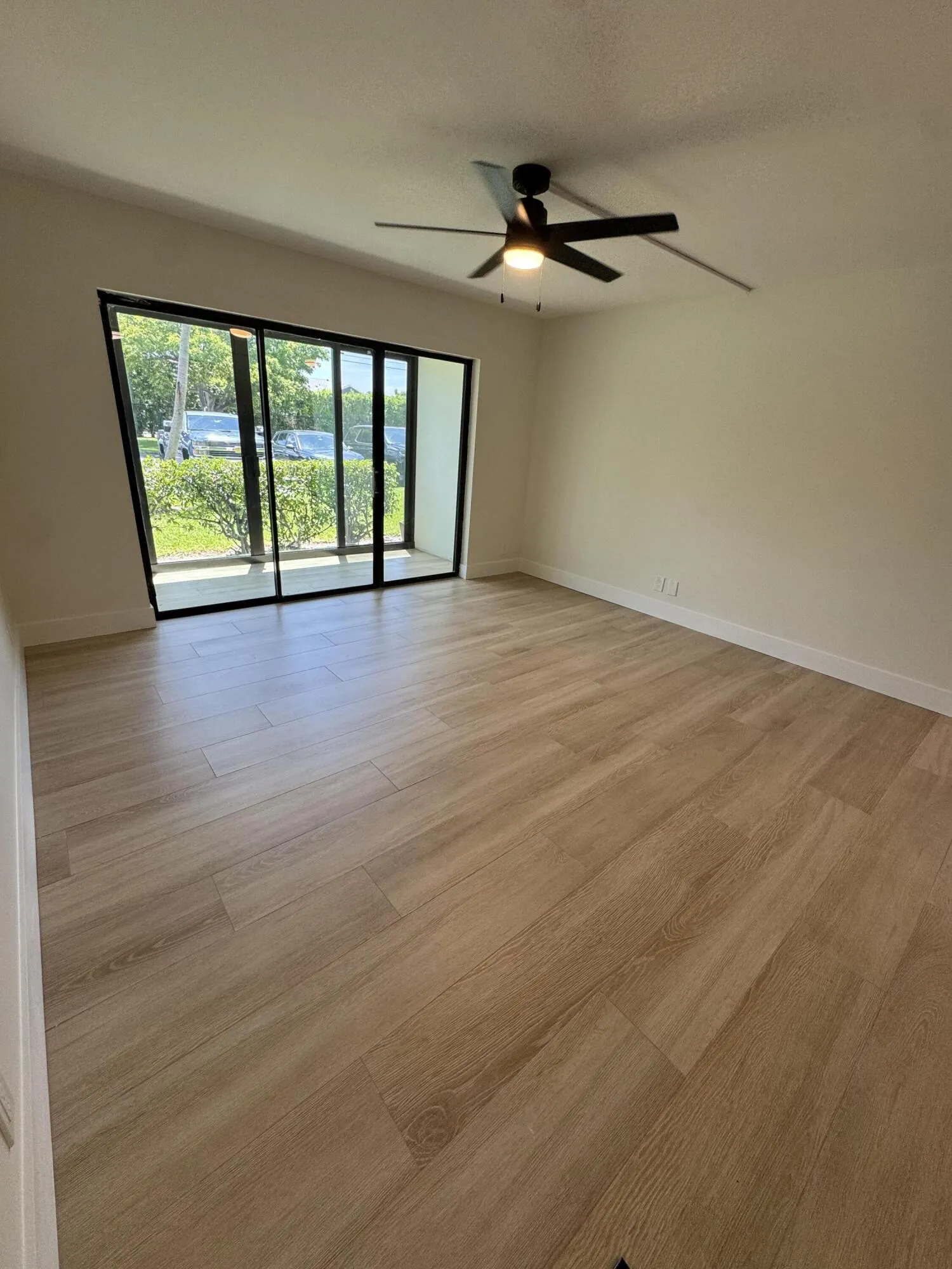 Living Room with Hurricane Impact Slider Enclosing Patio