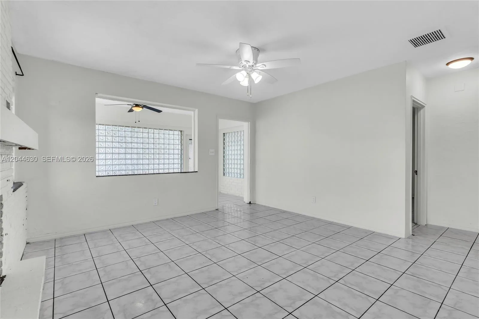 Middle area living room between bedrooms, kitchen, and sun room.