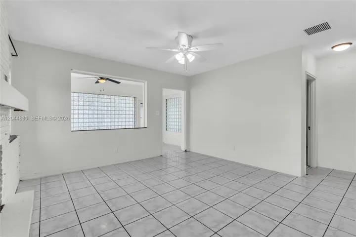 Middle area living room between bedrooms, kitchen, and sun room.