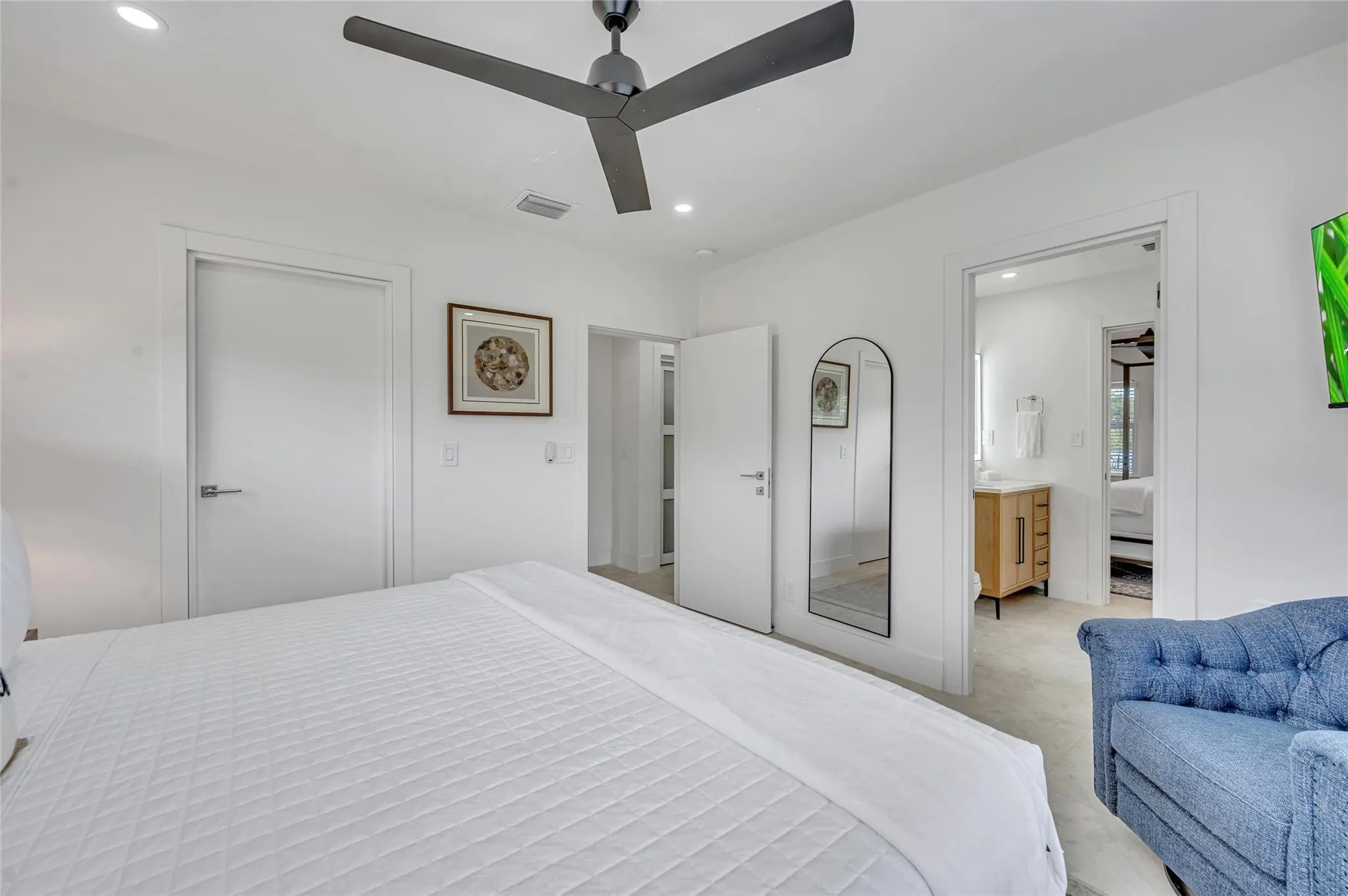 guest bedroom #3 has direct access to guest bathroom. features large walk in closet, ceiling fan, and tons of natural light!