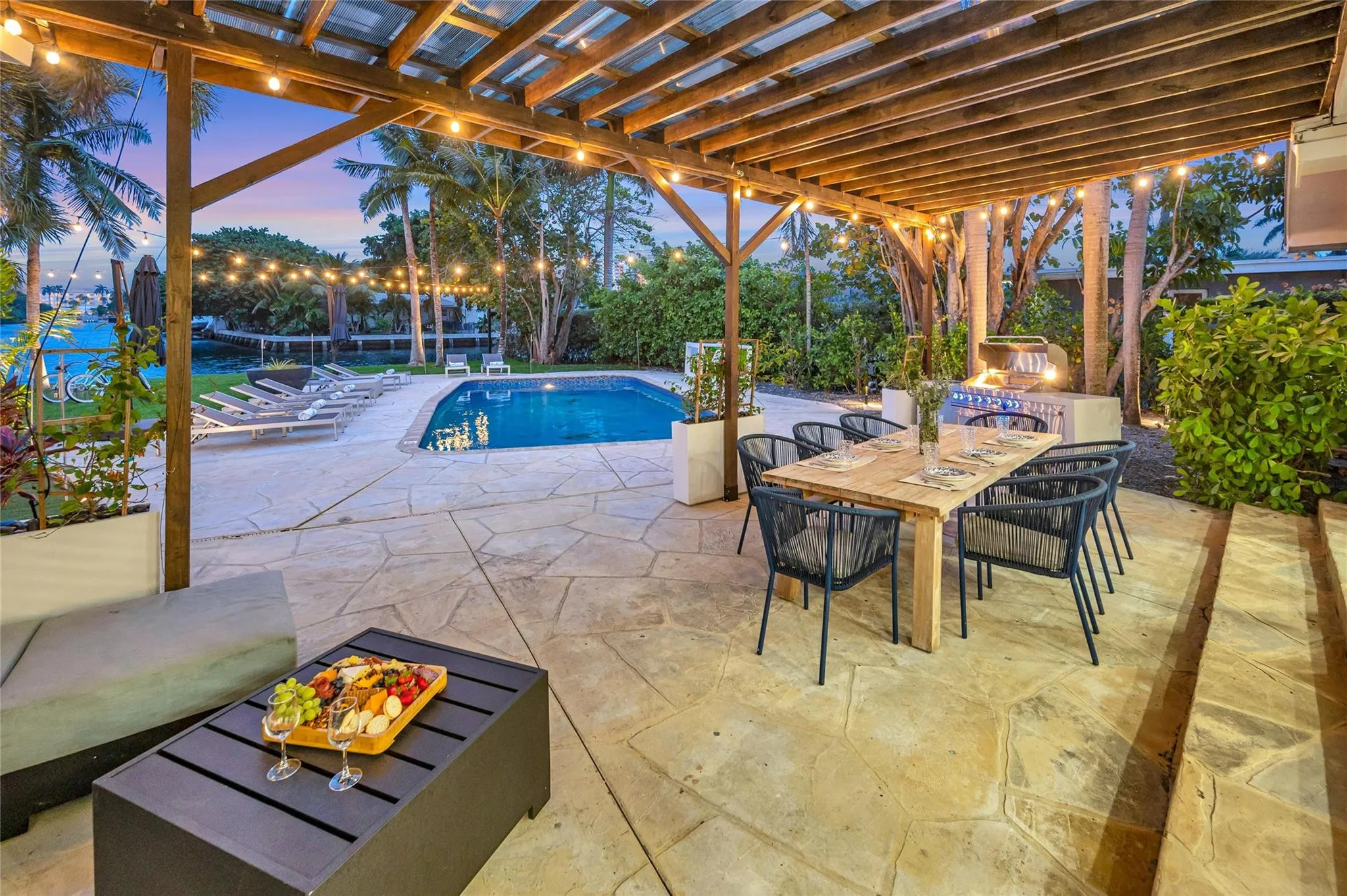 15x30 covered patio space, Natural gas Grill space with prep area on each side, Electric outlets and lighting.