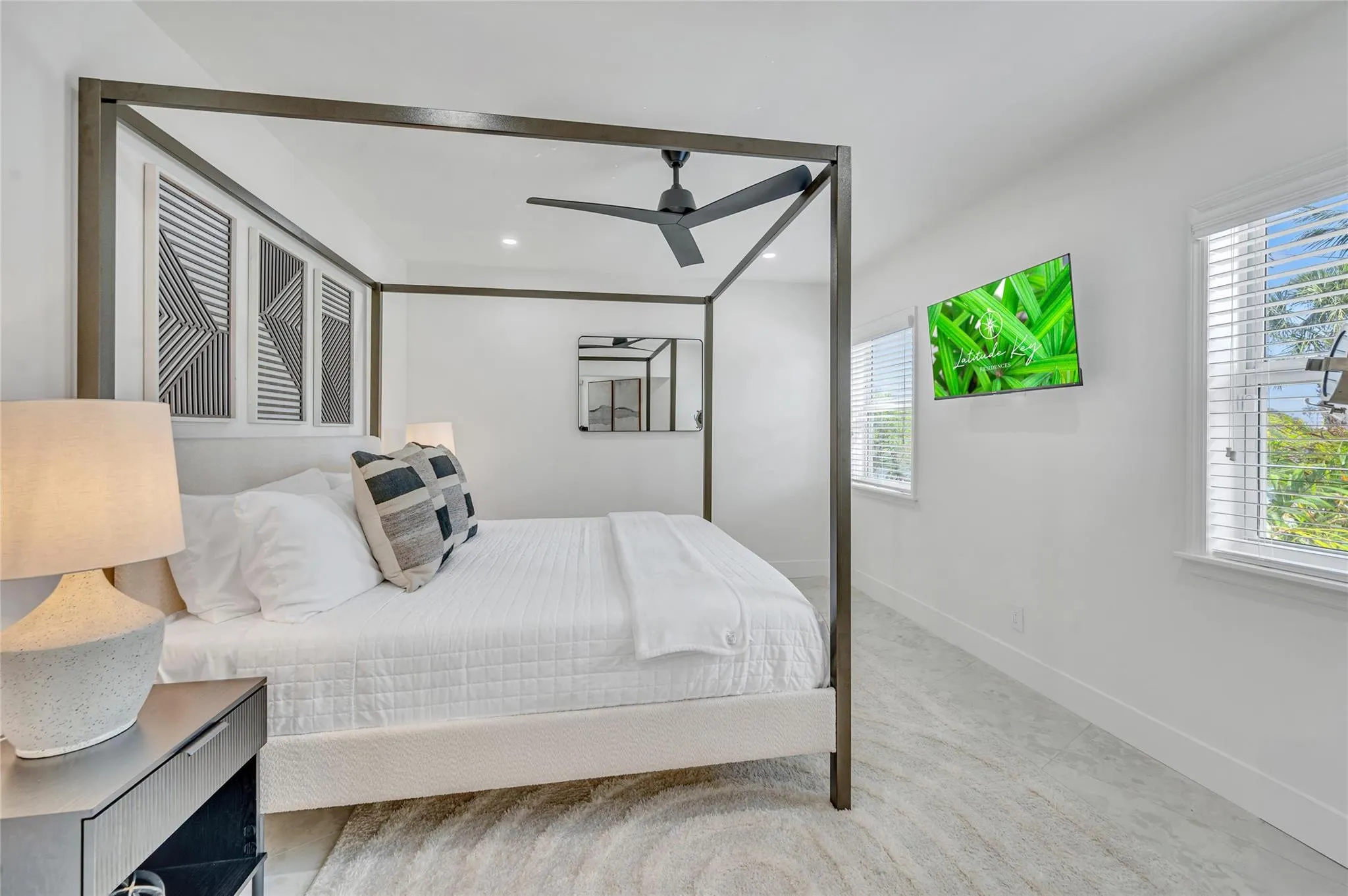 Primary Bedroom isolated from the guest bedrooms. Has a view to the back of pool and straight down the canal. Additionally a beautiful high end finishes in the primary bathroom and walk in closet.