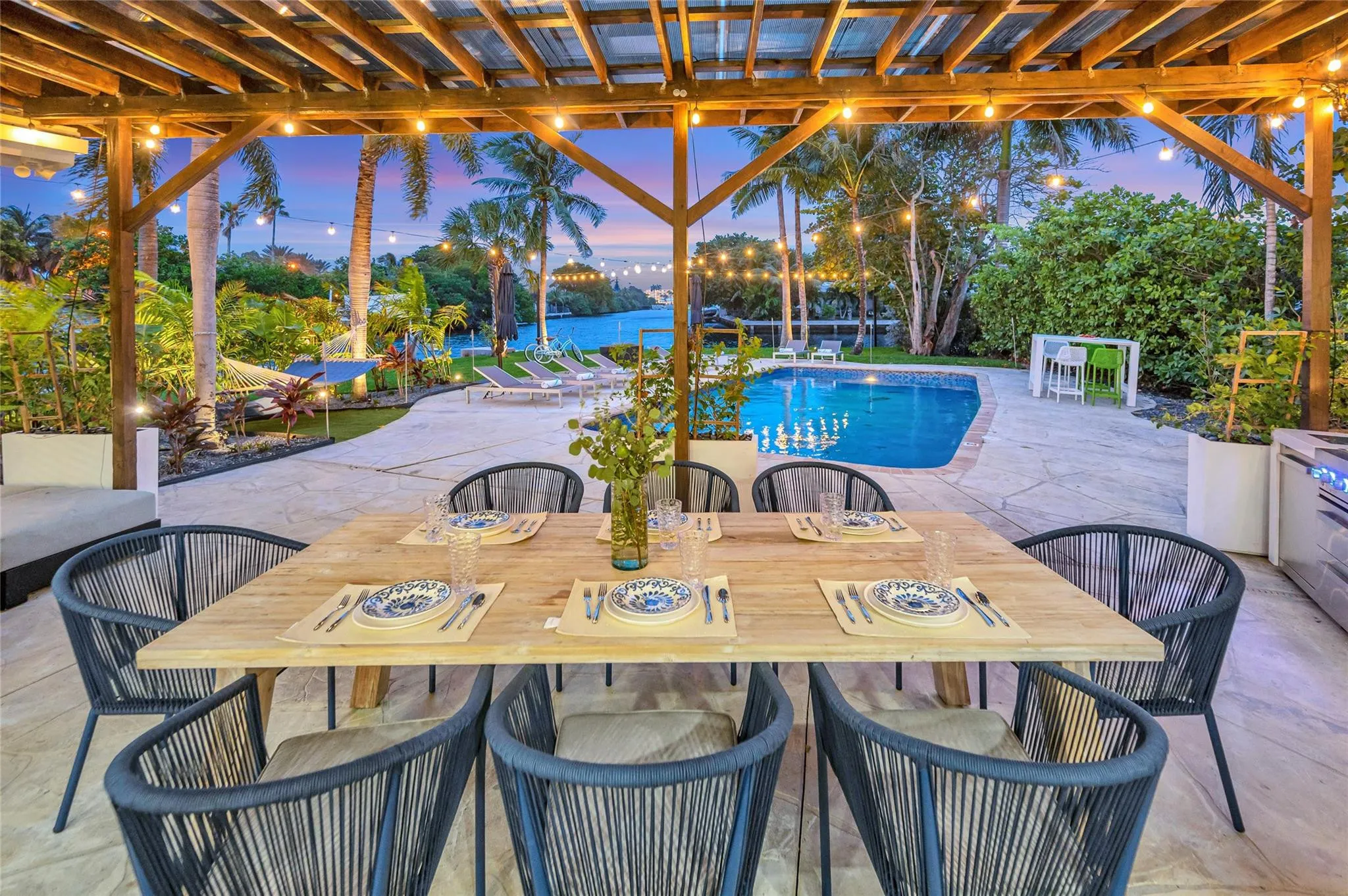 15x30 covered patio space, Natural gas Grill space with prep area on each side, Electric outlets and lighting.