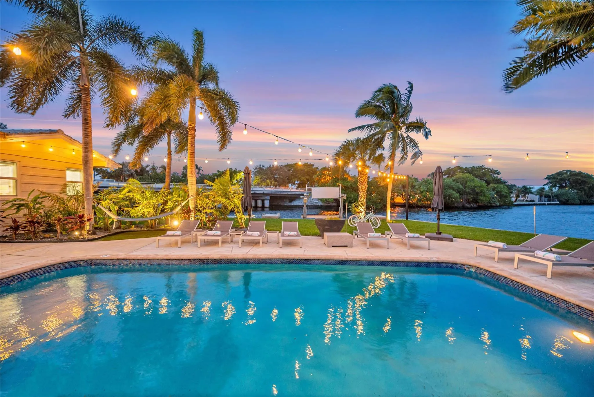 15x 30 heated pool with New Jandy pool equipment: variable-speed pump, salt system, iAqualink Wi-Fi control Fully renovated landscaping with new sod, Palm trees, flowers and plants, Wi-Fi-enabled sprinkler system, Custom landscape lighting including overhead string lights