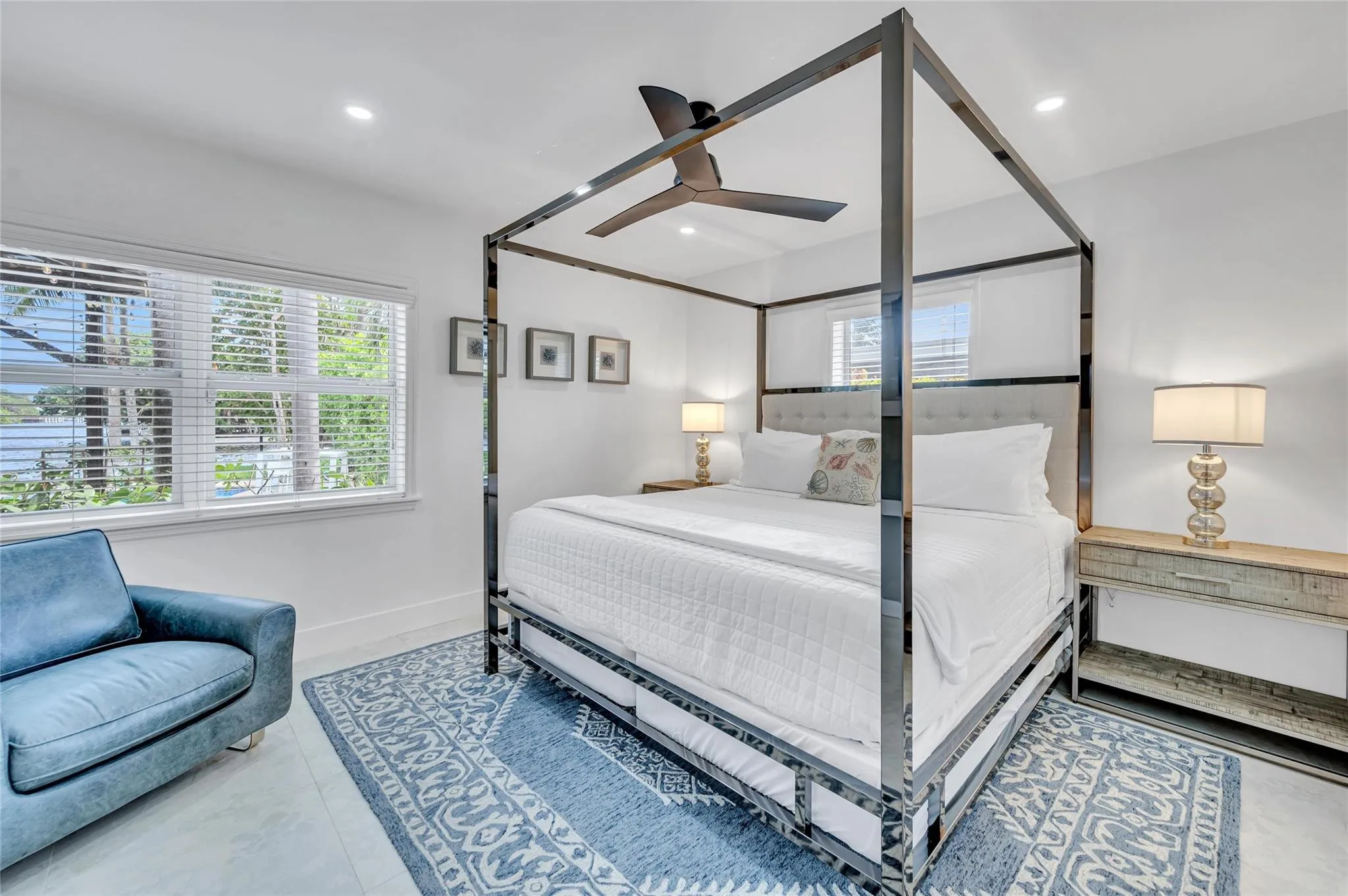 guest bedroom #4 has direct access to guest bathroom. features large sliding closet with built ins. can lights, and tons of natural light with views of the pool and canal!