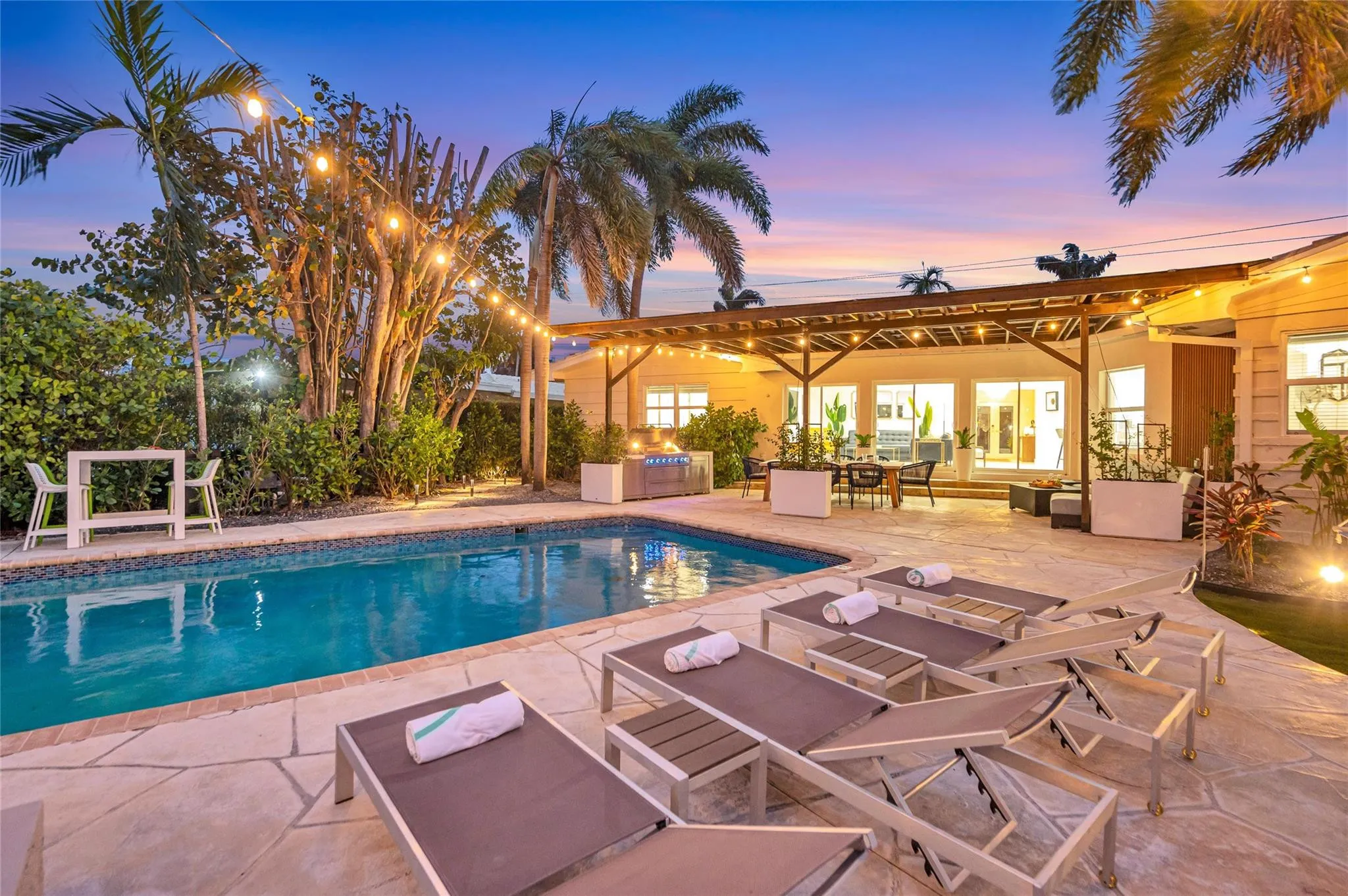 15x 30 heated pool with New Jandy pool equipment: variable-speed pump, salt system, iAqualink Wi-Fi control Fully renovated landscaping with new sod, Palm trees, flowers and plants, Wi-Fi-enabled sprinkler system, Custom landscape lighting including overhead string lights