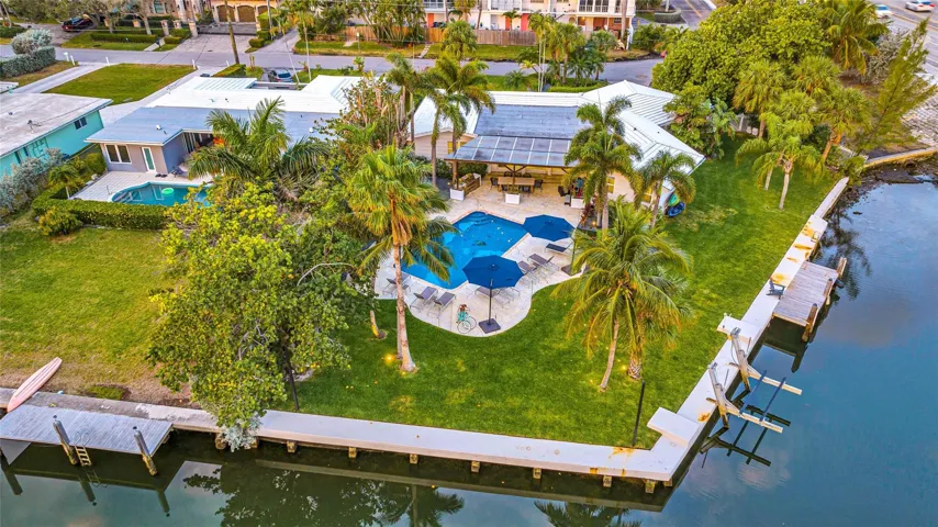 134-feet of waterfront on oversized 1/3-acre interior point lot, Breathtaking waterway views (day and night), boat lift with ocean access 5 mins to the inlet!