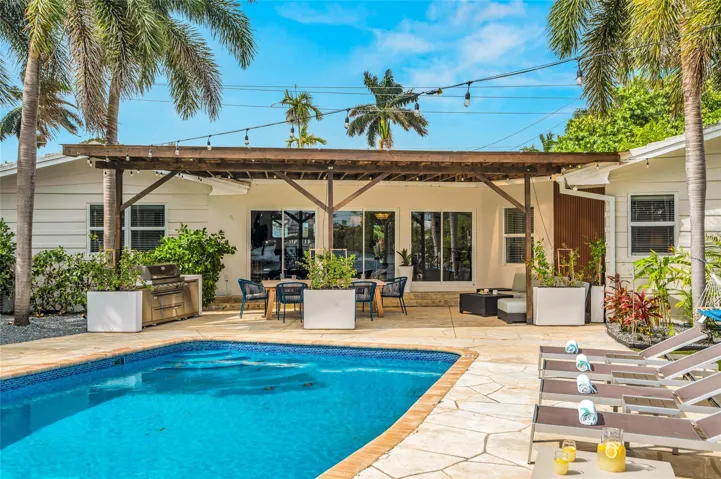 15x 30 heated pool with New Jandy pool equipment: variable-speed pump, salt system, iAqualink Wi-Fi control Fully renovated landscaping with new sod, Palm trees, flowers and plants, Wi-Fi-enabled sprinkler system, Custom landscape lighting including overhead string lights