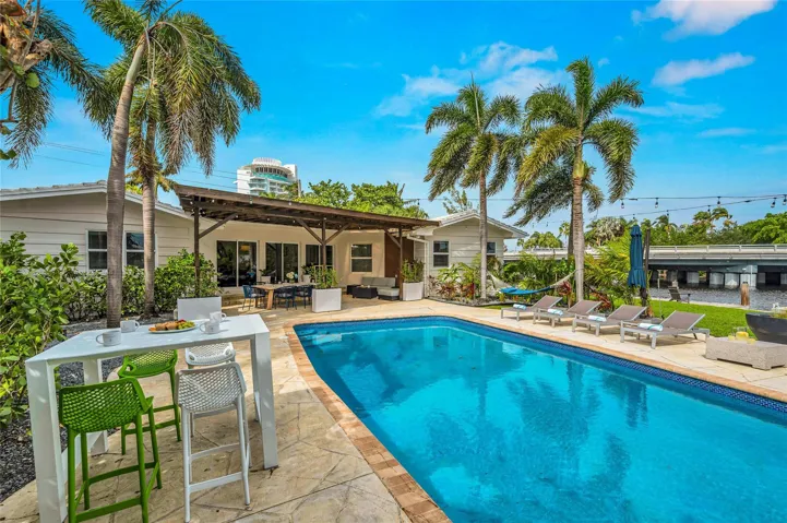 15x 30 heated pool with New Jandy pool equipment: variable-speed pump, salt system, iAqualink Wi-Fi control Fully renovated landscaping with new sod, Palm trees, flowers and plants, Wi-Fi-enabled sprinkler system, Custom landscape lighting including overhead string lights