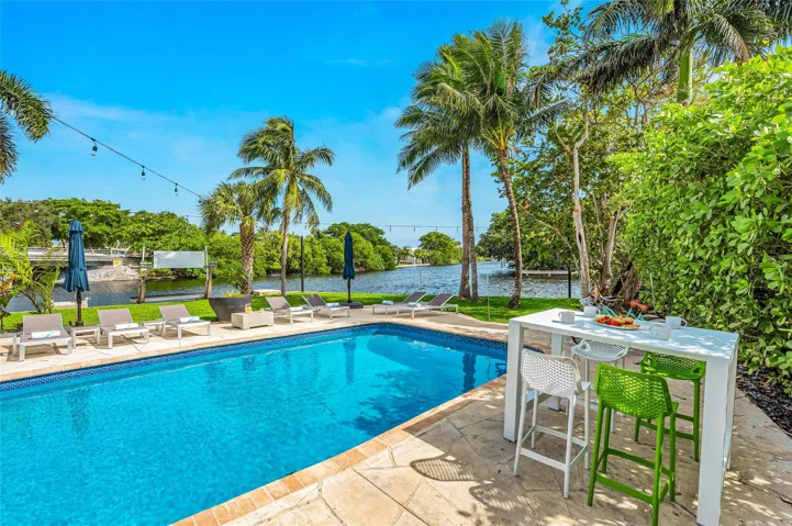 15x 30 heated pool with New Jandy pool equipment: variable-speed pump, salt system, iAqualink Wi-Fi control Fully renovated landscaping with new sod, Palm trees, flowers and plants, Wi-Fi-enabled sprinkler system, Custom landscape lighting including overhead string lights