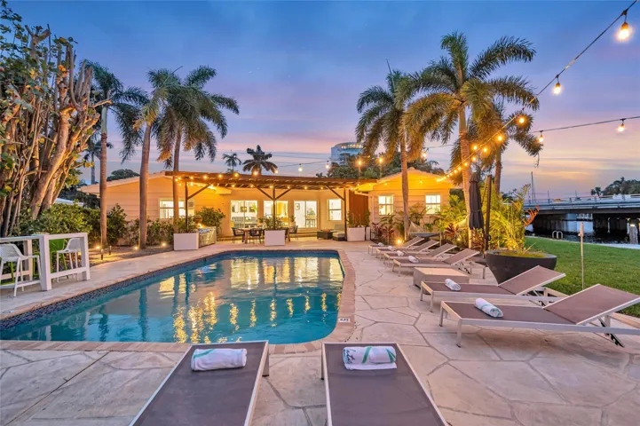 15x 30 heated pool with New Jandy pool equipment: variable-speed pump, salt system, iAqualink Wi-Fi control Fully renovated landscaping with new sod, Palm trees, flowers and plants, Wi-Fi-enabled sprinkler system, Custom landscape lighting including overhead string lights