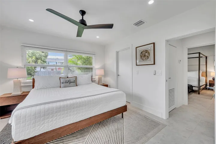 guest bedroom #3 has direct access to guest bathroom. features large walk in closet, ceiling fan, and tons of natural light!