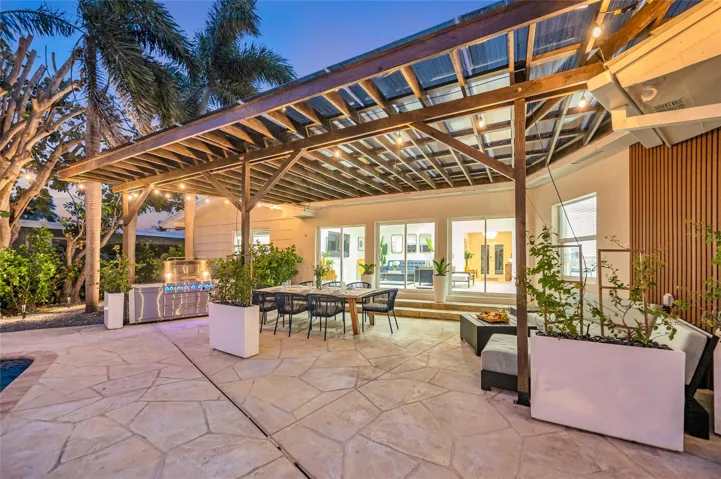 15x30 covered patio space, Natural gas Grill space with prep area on each side, Electric outlets and lighting.