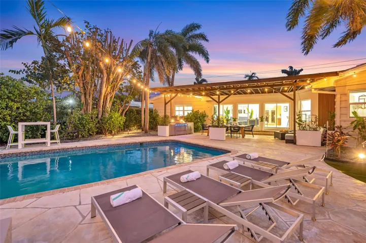 15x 30 heated pool with New Jandy pool equipment: variable-speed pump, salt system, iAqualink Wi-Fi control Fully renovated landscaping with new sod, Palm trees, flowers and plants, Wi-Fi-enabled sprinkler system, Custom landscape lighting including overhead string lights