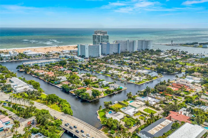 Aerial view of Harbor inlet and Port Everglade Inlet. with a walk to the beach and Inlet itself or from your back yard 5 min boat ride to the ocean!