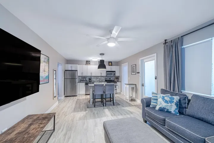 Right door is entry into open kitchen and living area. Offered turnkey furnished.
